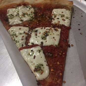 Luigi's Pizza - A mozzarella slice with chili flakes and white pepper - Pizza Near Me - Brooklyn, New York Luigi's Pizza - A mozzarella slice with chili flakes and white pepper - Pizza Near Me - Brooklyn, New York