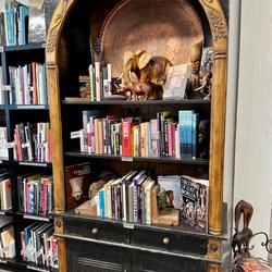 Marissa's Bookstore - Unique wooden sculptures and handmade art among the books