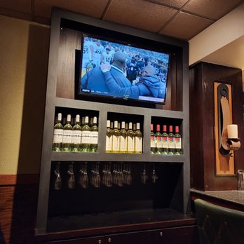 Carrabba's Italian Grill - a television and wine rack - Italian Near Me - Brick, New Jersey Carrabba's Italian Grill - a television and wine rack - Italian Near Me - Brick, New Jersey