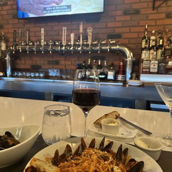 Duck Press - At the Bar, pasta with mussels, glass of Pino and Stanley Tucci in Italy. Heaven. - Wine Bars Near Me - South Kingstown, Rhode Island