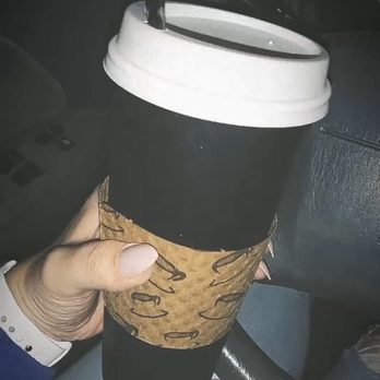 Rainier Valley Coffee - a hand holding a coffee cup - Coffee & Tea Near Me - Renton, Washington