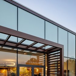Vine Dental - Glass entrance and pergola at Vine Dental, where patients step into a bright lobby at the dentist Kelowna families choose.