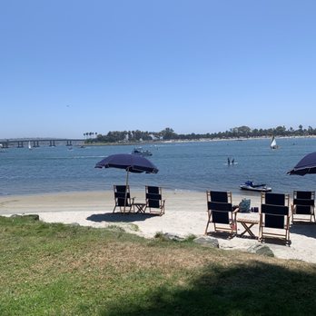 Paradise Point - Paradise Point beach bay front area chairs and umbrellas provided by the resort - Resorts Near Me - San Diego, California