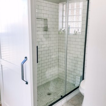 Honey Do - a bathroom with a glass shower door - Landscaping Near Me