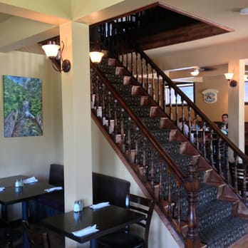 The Granite - a dining room with a staircase leading to the second floor - Canadian (New) Near Me - Bancroft, Ontario The Granite - a dining room with a staircase leading to the second floor - Canadian (New) Near Me - Bancroft, Ontario