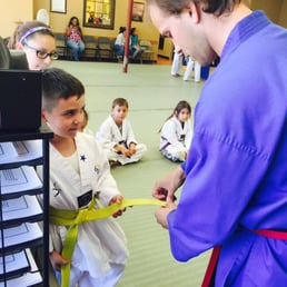 My son being rewarded his stripe.