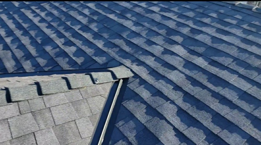 Slide of AE Roofing Experts