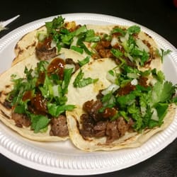 Taqueria Pancho Villa - 2 carne asada and 2 al pastor tacos.