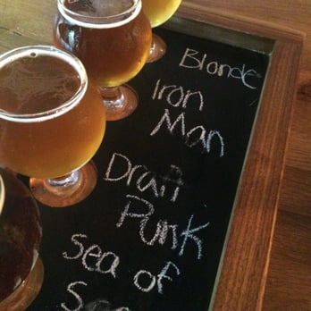 Park Tavern - Flights from Oliver Brewing are nicely done on a chalk board that have cut out for the glasses. - American Near Me - Severna Park, Maryland Park Tavern - Flights from Oliver Brewing are nicely done on a chalk board that have cut out for the glasses. - American Near Me - Severna Park, Maryland