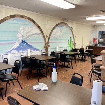 Taco Kitchen - tables and chairs in a restaurant - Tacos Near Me - Charleston, South Carolina