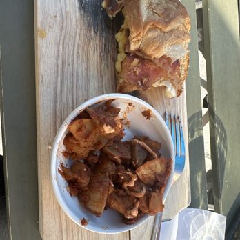 Café Miriam- City Park - Egg  and bacon  croissant   with spicy  potatoes - Coffee & Tea Near Me - Denver, Colorado