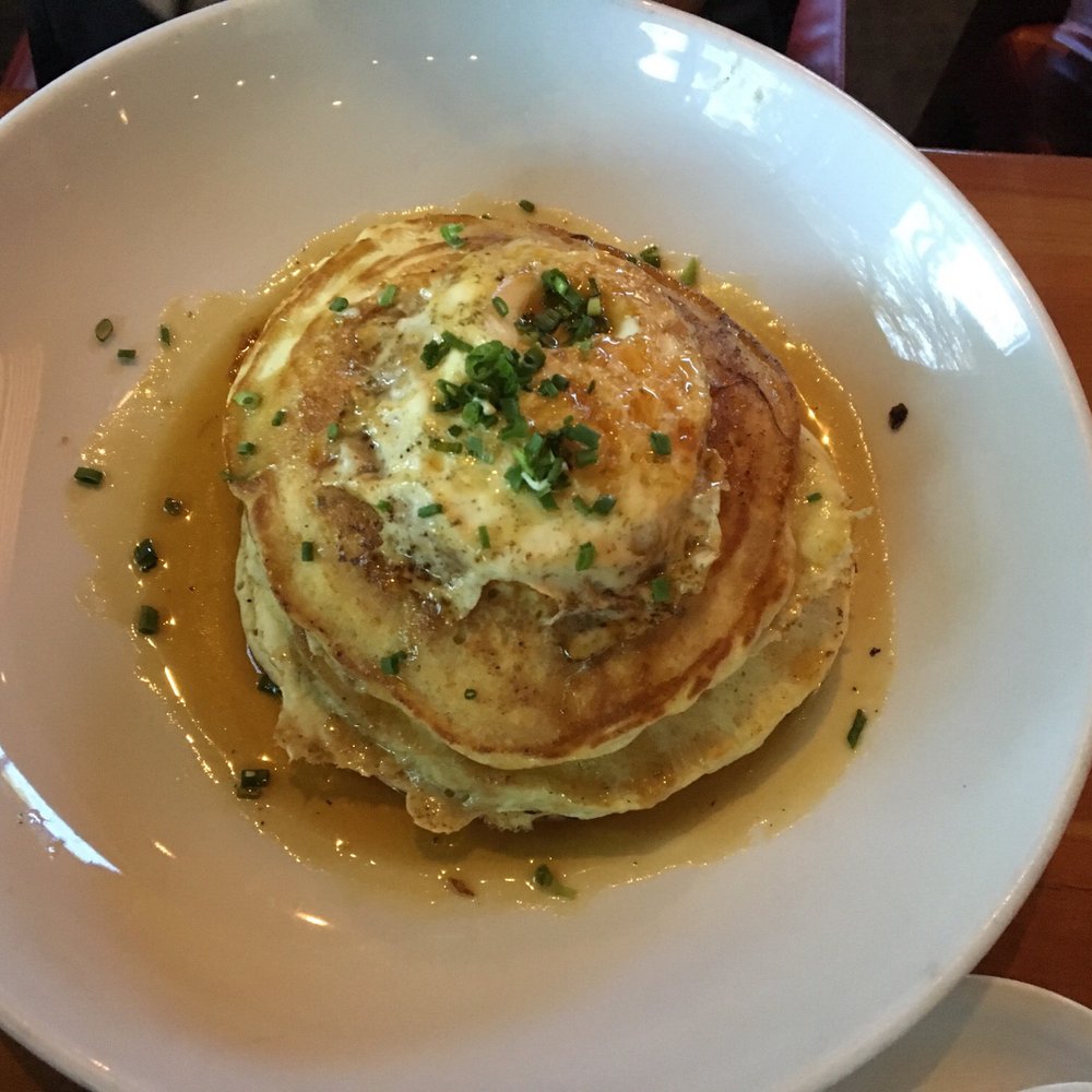 Roaring Fork - Pulled pork and herbed pancakes. The pork is layered between pancakes - New American Near Me - Austin, Texas Roaring Fork - Pulled pork and herbed pancakes. The pork is layered between pancakes - New American Near Me - Austin, Texas