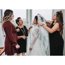Genesis Bridal Couture Studio - The 40 year old wedding dress that the owner restored and changed to make it more modern.