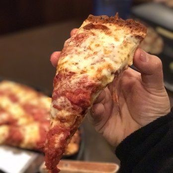Chicago's Pizza - a hand holding a slice of pizza - Pizza Near Me - Indianapolis, Indiana Chicago's Pizza - a hand holding a slice of pizza - Pizza Near Me - Indianapolis, Indiana