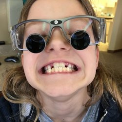 Jacqueline Belter - Youngest wants to be a dentist when she grows up and are. Dr. Belter let her sit in her chair and put on her glasses.