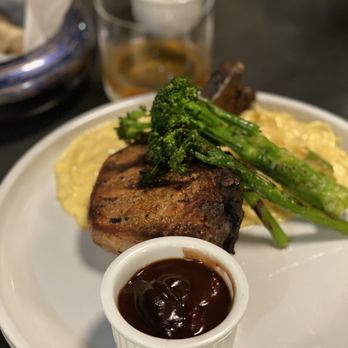 Oreatha's at The Point - Grilled Porkchop With Broccolini and 4 Cheese Pasta with a Demi Glaze - Cocktail Bars Near Me - Atlanta, Georgia Oreatha's at The Point - Grilled Porkchop With Broccolini and 4 Cheese Pasta with a Demi Glaze - Cocktail Bars Near Me - Atlanta, Georgia