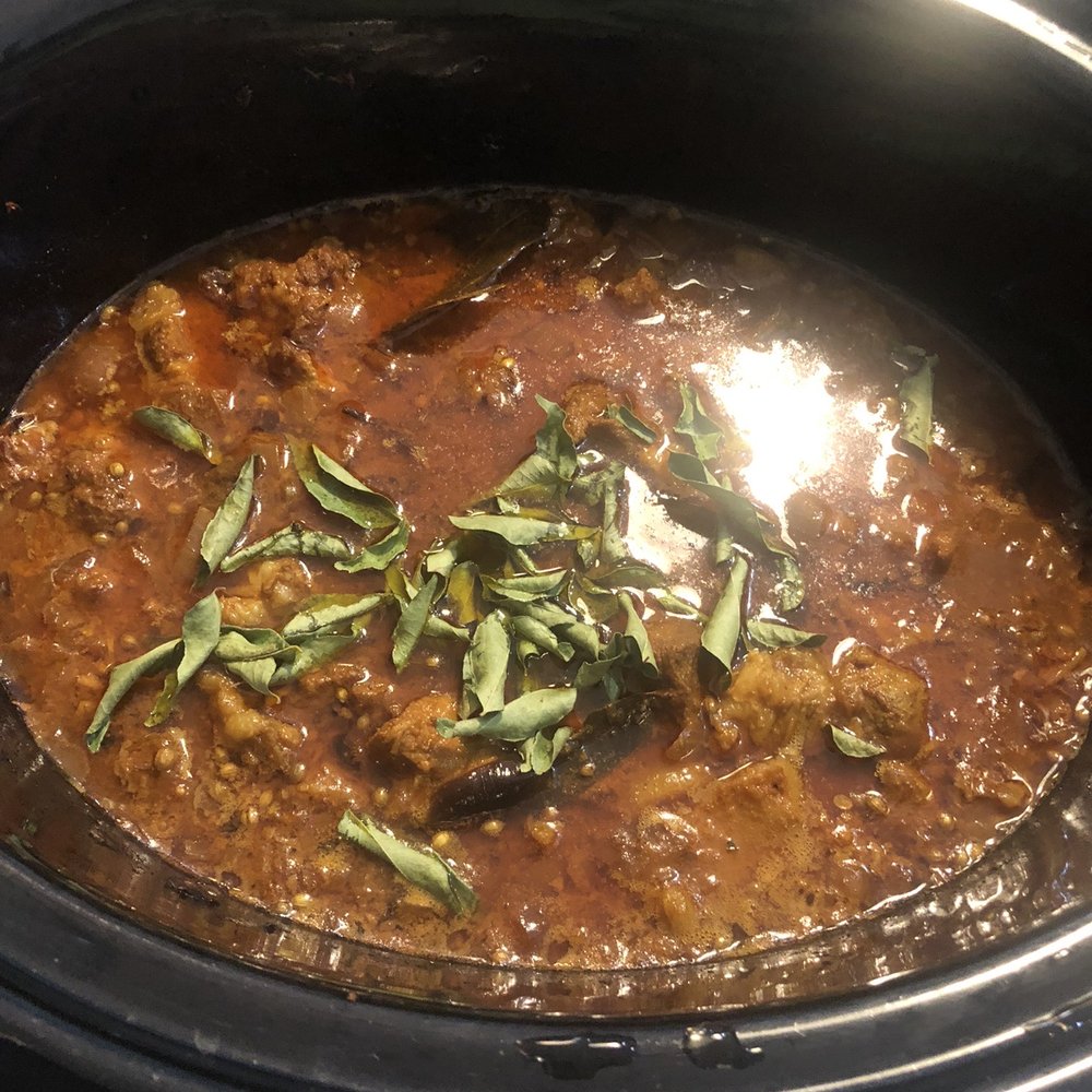 Butter Chicken - a close up of a stew in a slow cooker - Indian Near Me - Toronto, Ontario Butter Chicken - a close up of a stew in a slow cooker - Indian Near Me - Toronto, Ontario