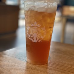 Starbucks - Black tea with lemonade and a bit of sugar.