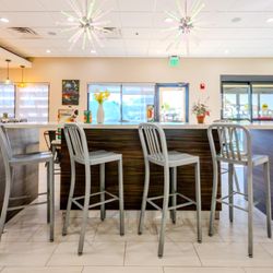 Holiday Inn Brownsville - On-site bar with modern seating and relaxed atmosphere at Holiday Inn Brownsville, an IHG Hotel in Brownsville, Texas.