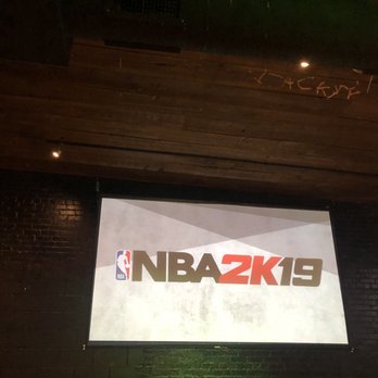 Black Sheep - a basketball game being played on a big screen - Dance Clubs Near Me - Lubbock, Texas