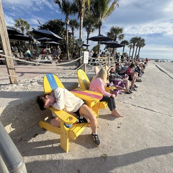 Paradise Grille - Colorful chairs facing the ocean - Bars Near Me - St Pete Beach, Florida Paradise Grille - Colorful chairs facing the ocean - Bars Near Me - St Pete Beach, Florida