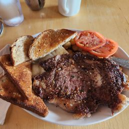 10oz rib eye steak and eggs. 10oz rib eye steak and eggs.