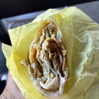 Amigos Tacos - Breakfast burrito. $14. Not shareable. - Mexican Near Me - Manhattan Beach, California Amigos Tacos - Breakfast burrito. $14. Not shareable. - Mexican Near Me - Manhattan Beach, California