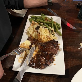 Peter Christian's Tavern - Bourbon steak tips with delicious mashed potatoes and roasted almonds, green beans. - American Near Me - New London, New Hampshire Peter Christian's Tavern - Bourbon steak tips with delicious mashed potatoes and roasted almonds, green beans. - American Near Me - New London, New Hampshire