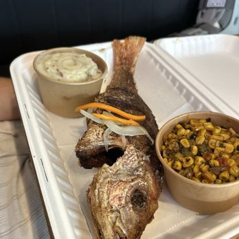 Jerks Caribbean Grill - Fried whole snapper, roasted corn and garlic, mashed potatoes. - Caribbean Near Me - Atlanta, Georgia Jerks Caribbean Grill - Fried whole snapper, roasted corn and garlic, mashed potatoes. - Caribbean Near Me - Atlanta, Georgia
