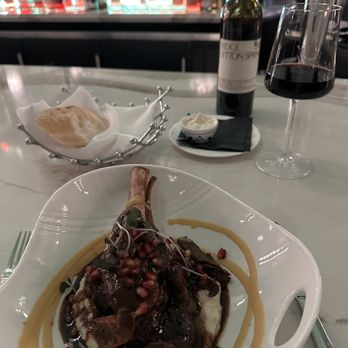 Fhima’s Minneapolis - Lamb shank confit with pomegranate. - Cocktail Bars Near Me - Minneapolis, Minnesota Fhima’s Minneapolis - Lamb shank confit with pomegranate. - Cocktail Bars Near Me - Minneapolis, Minnesota
