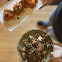 Staples on the menu: brussels bravas & buffalo cauliflower
