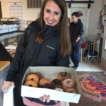 Eddie's Southtown Donuts - a woman holding a box of donuts - Donuts Near Me - Saint Louis, Missouri Eddie's Southtown Donuts - a woman holding a box of donuts - Donuts Near Me - Saint Louis, Missouri