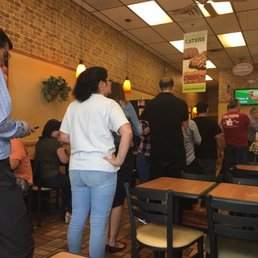 a group of people in a restaurant a group of people in a restaurant