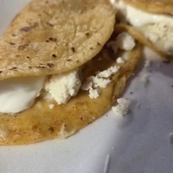 Vanessas Tijuana Tacos - Mini handmade cheese, sour cream taco.