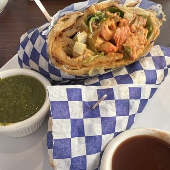 Masala Waves - Chicken Tikki Masala wrap. The chicken is wrapped in toasted naan, chicken, veggies, cucumbers. Juicy goodness. - Indian Near Me - Huntington Beach, California Masala Waves - Chicken Tikki Masala wrap. The chicken is wrapped in toasted naan, chicken, veggies, cucumbers. Juicy goodness. - Indian Near Me - Huntington Beach, California