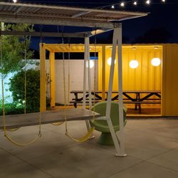 SCAD Montgomery Hall - "Carnival" dining patio area. Swing while you enjoy your meal.