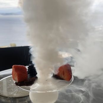 The Loupe Lounge - Water being poured into Dry Ice before being served as dessert. - Lounges Near Me - Seattle, Washington The Loupe Lounge - Water being poured into Dry Ice before being served as dessert. - Lounges Near Me - Seattle, Washington