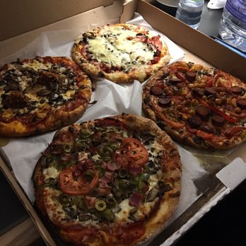 Mille et une Pizzas - Smoked meat (top), Merguez (right), Spéciale garnie (bottom), Calabrese (left) - Pizza Near Me - Quebec City, Quebec