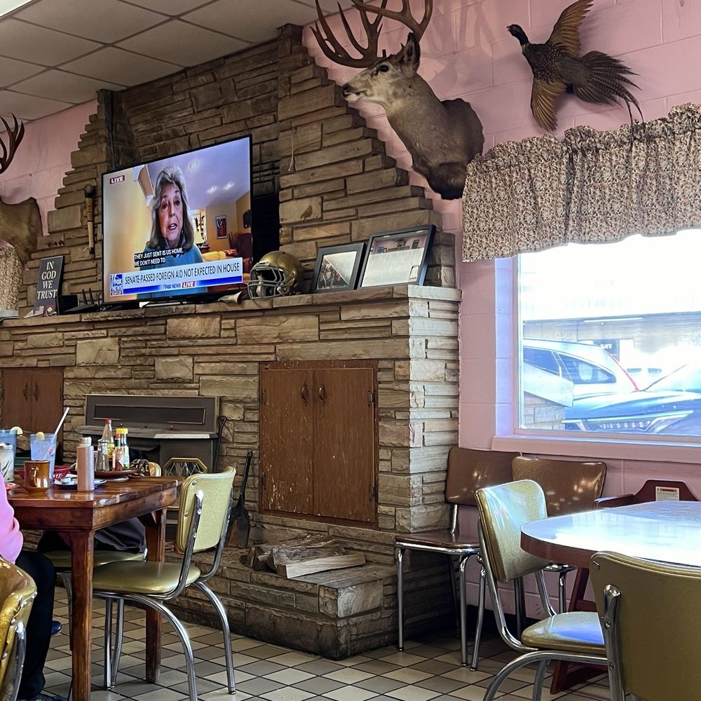 Neal's Cafe - a woman sitting at a table - Diners Near Me - Springdale, Arkansas Neal's Cafe - a woman sitting at a table - Diners Near Me - Springdale, Arkansas