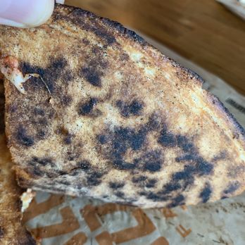 Blaze Pizza - Bottom of a slice of burnt 1 Top Pizza (11-inch) - Pizza Near Me - Carlsbad, California