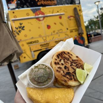Medellin Empanadas - a person holding a plate of food - Colombian Near Me - Las Vegas, Nevada