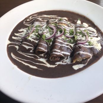 Bistrola 57 - Chicken and Gouda cheese enchiladas in a black bean sauce - French Near Me - Mérida, YUC Bistrola 57 - Chicken and Gouda cheese enchiladas in a black bean sauce - French Near Me - Mérida, YUC