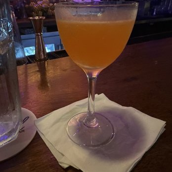 Revel Cafe and Bar - a glass of orange juice - Cocktail Bars Near Me - New Orleans, Louisiana