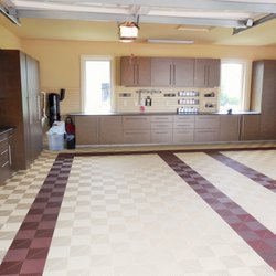 Beach Custom Closets & More - Garage cabinets with long work top and slat wall for tool storage and interlocking flooring