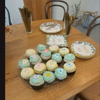 LoveCakes - a plate of cupcakes on a table - Cupcakes Near Me LoveCakes - a plate of cupcakes on a table - Cupcakes Near Me