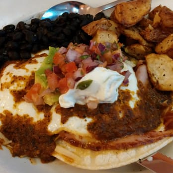 Sunset Grill - Huevos rancheros served over corn tortillas and ham.  Very tasty!!!! - American Near Me - Fredericksburg, Texas