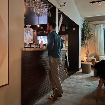 Laureate - a man standing in front of a bar - Lounges Near Me - San Francisco, California Laureate - a man standing in front of a bar - Lounges Near Me - San Francisco, California