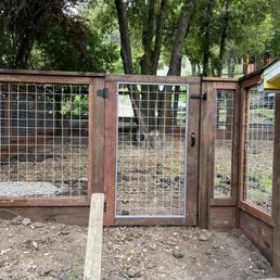 Gate and fence right up next to the house. Gate and fence right up next to the house.