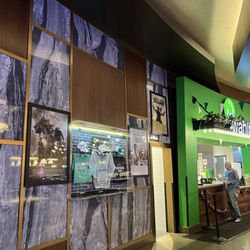 Wahlburgers - Wall of poster artwork.