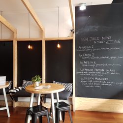 Pressed Juices - Menu board and seating area